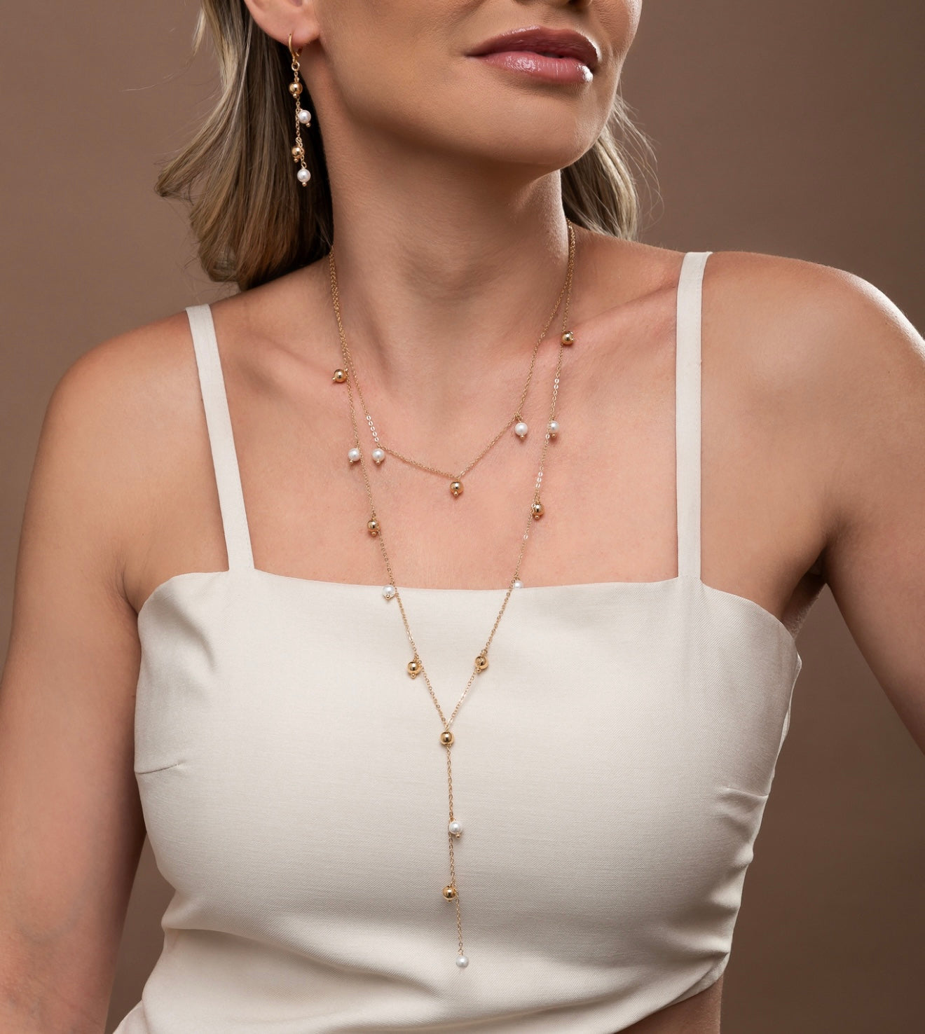 Set of golden balls and shell pearls