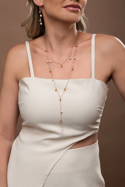 Set of golden balls and shell pearls
