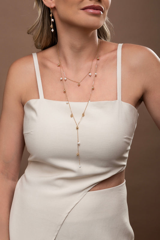 Set of golden balls and shell pearls